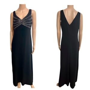 Stunning black Daymor Couture evening dress featuring intricate beaded detail.